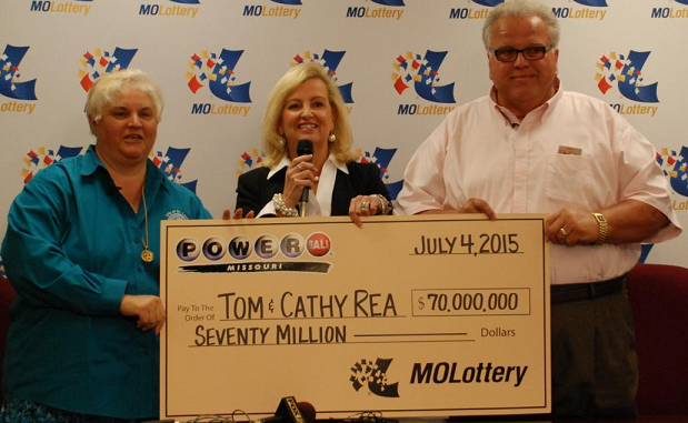 Tom and Cathy Rea accept their oversized check for $70 million from Missouri Lottery director May
